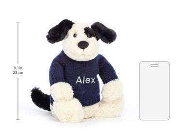 Chiot timide noir et crème avec pull bleu marine personnalisé